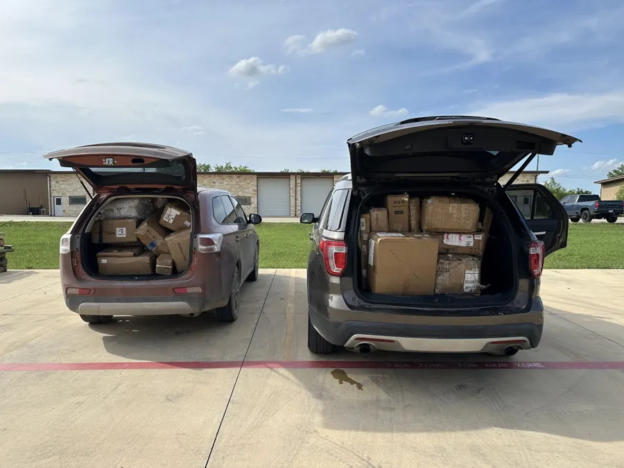 Two SUVs packed with auction wins at pickup
