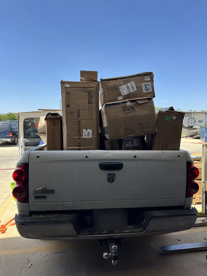 Pickup truck loaded with boxed lots